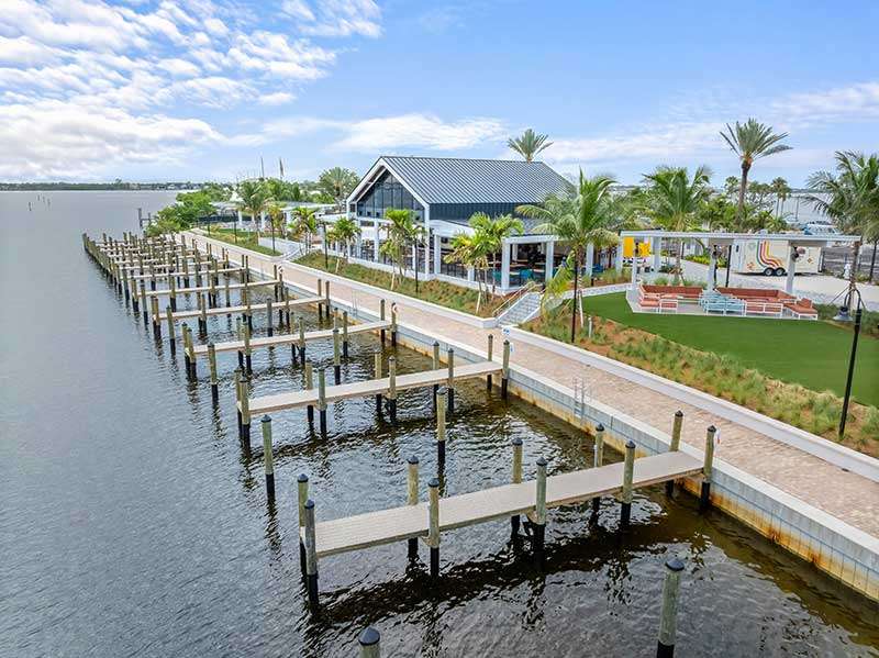 Waterfront view with docks and palm trees