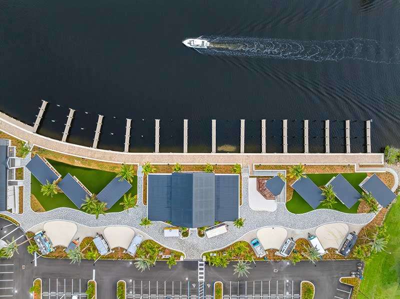 Aerial view of docks and landscape near water.