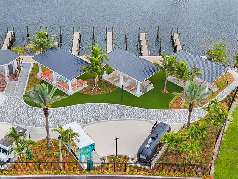 Aerial view of waterfront pavilions and dock.